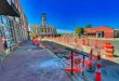 Chantier routier en ville interrompu, illustrant la force majeure dans un marché public